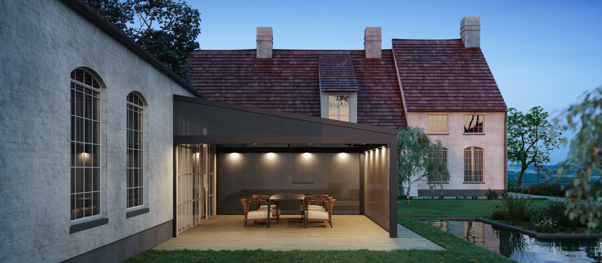 Aluminium pergola with sloping retractable fabric roof and integrated spot lighting creating a refined outdoor dining area beside a traditional home